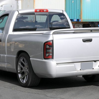 2002-2006 Dodge RAM 1500/2500/3500 Red LED Bar Tail Lights Matte Black/Clear